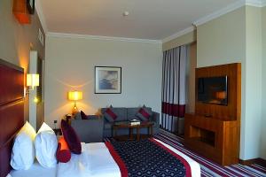 Een TV en/of entertainmentcenter bij Wonder Palace Hotel Qatar
