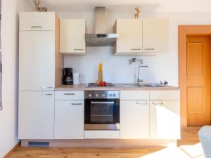 Dapur atau dapur kecil di Friendly apartment in a dream location in Going am Wilden Kaiser