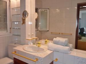 a white bathroom with a sink and a mirror at Holiday Home Mijas-Costa near Beach in La Cala de Mijas +32 photos