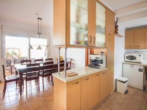 a kitchen and dining room with a table and chairs at Holiday Home Mijas-Costa near Beach in La Cala de Mijas