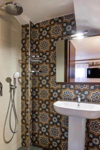 a bathroom with a sink and a mirror at Beach Front Vintage Villa Kalliktratis in Nea Kalikratia