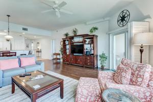 a living room with a couch and a table at Ocean View Arcane Condo in Fernandina Beach