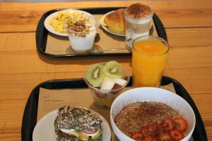 a tray with a tray of breakfast foods and drinks at RM The Experience - Small Portuguese Hotels in Setúbal