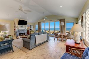 a living room with a view of the ocean at Fletcher Family Friendly Home in Fernandina Beach