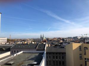 a view of a city from the roof of a building at Rent like home - Krysiewicza 3 in Poznań