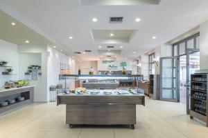 A kitchen or kitchenette at Gouves Bay by Omilos Hotels