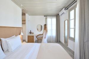 Postel nebo postele na pokoji v ubytování GrandeMar Suites