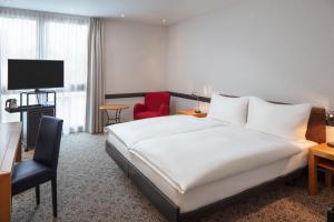 Letto o letti in una camera di Hotel Baslertor