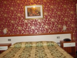 Postel nebo postele na pokoji v ubytování Albergo Boccadasse