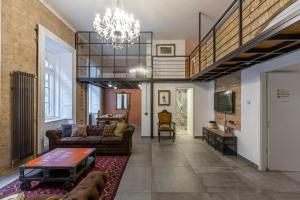 Televízia a/alebo spoločenská miestnosť v ubytovaní The Address Loft 22ppl