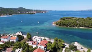an aerial view of a small island in a body of water at Villa Rosmarin - family friendly, beachfront in Pašman