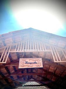 a sign hanging from the ceiling of a building at Shreegandha Homestay in Somvārpet