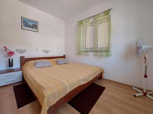 Postel nebo postele na pokoji v ubytování Apartment Niko