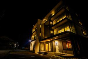 a building at night with its lights on at Grand Phenix Hakuba in Hakuba