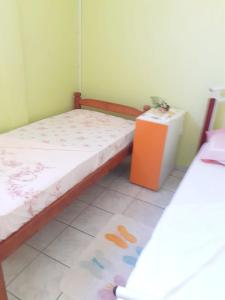 a small room with a bed and a table at Appartement de 2 chambres avec balcon et wifi a Sainte Marie a 6 km de la plage in Sainte-Marie