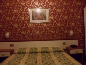 Postel nebo postele na pokoji v ubytování Albergo Boccadasse