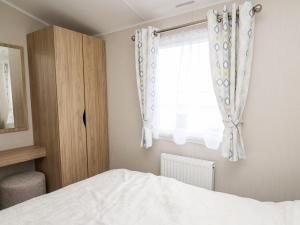 Postel nebo postele na pokoji v ubytování Ystwyth 26