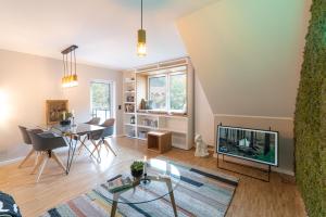 TV a/nebo společenská místnost v ubytování Waldbewohner Apartments / Fuchs