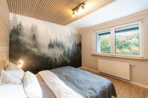 Postel nebo postele na pokoji v ubytování Waldbewohner Apartments / Fuchs