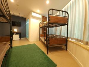 Voodi või voodid majutusasutuse OYO Hostel Myeongdong 3 toas
