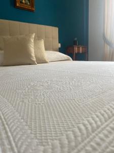 Voodi või voodid majutusasutuse Ortigia Twin Rooms toas