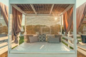A balcony or terrace at Gouves Bay by Omilos Hotels