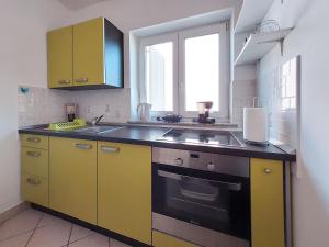 Kuchyň nebo kuchyňský kout v ubytování Apartment Niko