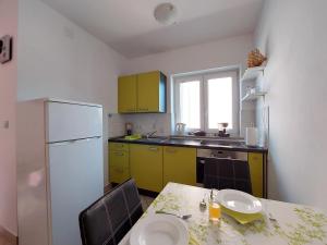 Kuchyň nebo kuchyňský kout v ubytování Apartment Niko