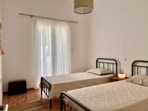 Postel nebo postele na pokoji v ubytování Apartment in Paros