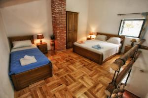 Voodi või voodid majutusasutuse B&B Apart Hotel Paštrovski Konak toas