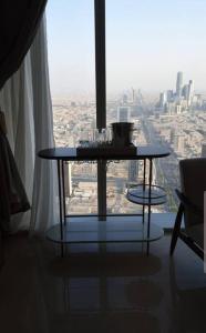 a table in a room with a view of a city at شقة خاصة برج رافال in Riyadh