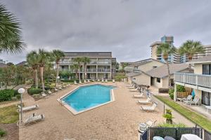 an image of a swimming pool at a resort at Convenient PCB Condo with Pool Access Walk to Beach in Panama City Beach