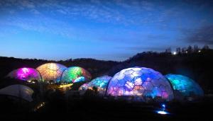 a group of colorful spheres lit up at night at Apartment 4 Biddicks Court in St Austell