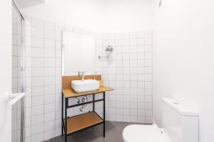 a bathroom with a sink and a mirror at Equador Superior Suites by Olala Homes in Cascais
