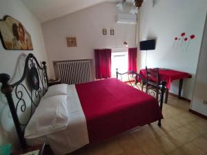 Postel nebo postele na pokoji v ubytování La Magnolia - Fano