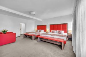 Postel nebo postele na pokoji v ubytování Hotel Nelly Kellys