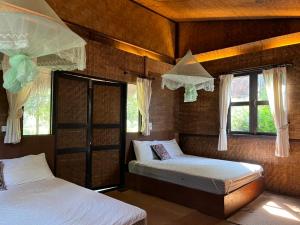 Postel nebo postele na pokoji v ubytování Paipunthong Resort