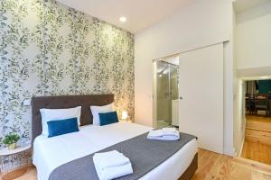 Un pat sau paturi într-o cameră la Patio de Santa Catarina - by Guest SPA