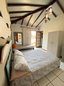 Una cama o camas en una habitación de Búzios com Estilo