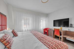 Postel nebo postele na pokoji v ubytování Hotel Nelly Kellys