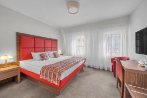 Postel nebo postele na pokoji v ubytování Hotel Nelly Kellys