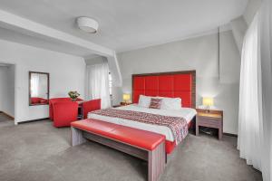Postel nebo postele na pokoji v ubytování Hotel Nelly Kellys