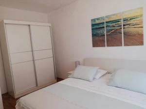 Postel nebo postele na pokoji v ubytování Apartments Podbarje