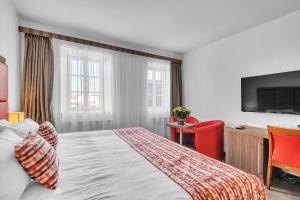 Postel nebo postele na pokoji v ubytování Hotel Nelly Kellys