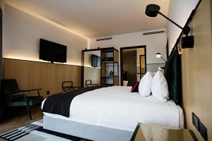 TV a/nebo společenská místnost v ubytování Met Hotel