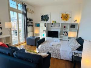 A seating area at POLITEAMA SUITE IN THE HEART OF THE CITY