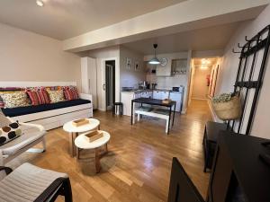 a living room with a couch and a table at Apartamento Sebreñu 1 in Ribadesella