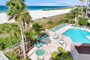 an aerial view of a pool and the beach at Crescent Beach Club I 5A in Clearwater Beach