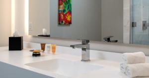 a bathroom with a sink and a mirror at Southland Casino Hotel in West Memphis