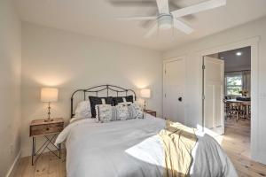 a bedroom with a bed and a ceiling fan at Modern Cottage Escape On Table Rock Lake! in Golden